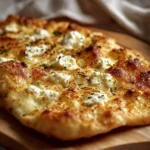 Delicious homemade 2 ingredient cottage cheese flatbread on a wooden board