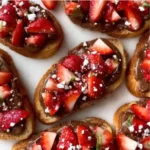 Chocolate Strawberry Bruschetta topped with fresh strawberries and drizzled chocolate
