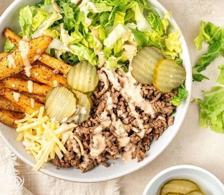 Delicious burger bowls served with fresh vegetables and toppings