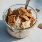 Cinnamon Toast Crunch Protein Ice Cream in a bowl with toppings.