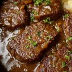 Delicious Crock Pot cube steak served with rich gravy and vegetables