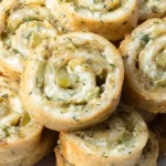 Dill Pickle Pinwheels on a serving platter, garnished and ready to eat.