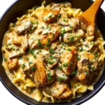 Delicious bowl of rich chicken stroganoff with mushrooms and noodles