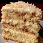 Delicious White German Chocolate Cake with rich chocolate frosting and coconut topping