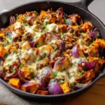 BBQ chicken sweet potato skillet dish served in a cast iron pan