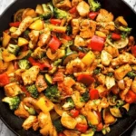 Garlicky chicken breast and colorful vegetables in a skillet recipe
