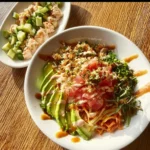 Assorted healthy bowls filled with fresh ingredients and vibrant seafood recipes.