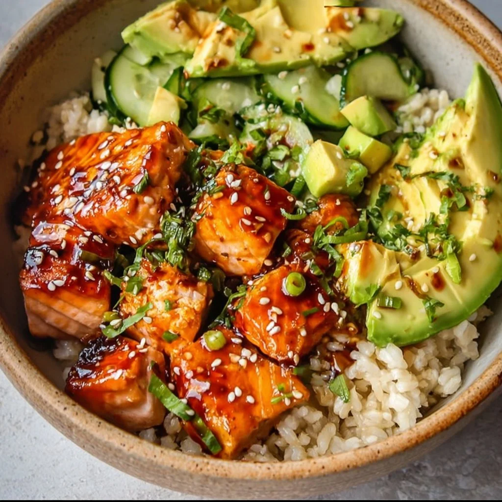 Delicious honey glazed salmon bowl served with vegetables and rice