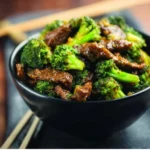 Delicious Instant Pot beef and broccoli served in a bowl with chopsticks.