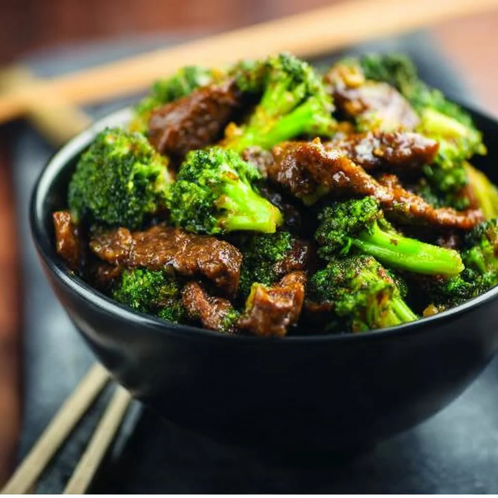 Delicious Instant Pot beef and broccoli served in a bowl with chopsticks.