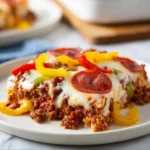 Delicious low carb pizza casserole served in a baking dish with melted cheese