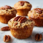 Delicious pecan pie muffins with brown sugar and crunchy nuts