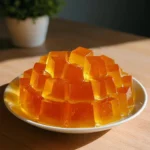 Person demonstrating the viral gelatin trick recipe with vibrant colors and textures.