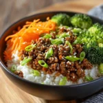 Korean Ground Beef Bowl garnished with vegetables and sesame seeds