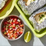 Mini breakfast burritos for meal prep, packed with eggs, veggies, and cheese.
