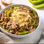 Delicious Philly Cheesesteak Bowl with beef, peppers, and cheese