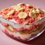 Strawberry Crunch Banana Pudding dessert with layers of banana and strawberries