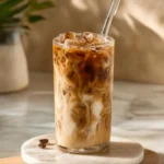 Various protein iced coffee recipes with ingredients and cups on a kitchen counter.