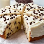 Delicious homemade Chocolate Chip Cake decorated with chocolate chips and icing.