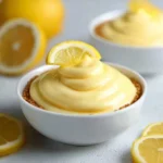 Delicious no bake lemon mousse in a dessert glass with lemon slices