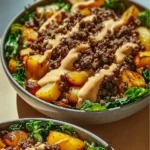 Delicious smash burger bowl garnished with fresh ingredients and served in a bowl