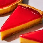 Raspberry Lemon Tart with fresh raspberries and lemon zest on a dessert plate