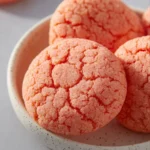Delicious Strawberry Box Cake Mix Cookies on a plate with fresh strawberries.