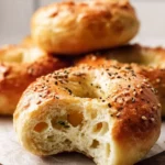 Homemade air fryer bagels served on a plate.