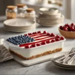 American Flag No-Bake Cheesecake decorated with berries and whipped cream