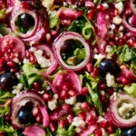 Blueberry pistachio spring salad with fresh greens and vibrant colors