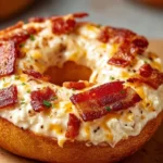 Creamy bacon cheddar bagels fresh out of the oven, golden brown and appetizing.