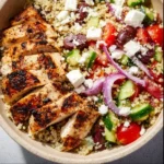 Delicious Greek Chicken Bowl with marinated chicken and fresh vegetables
