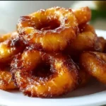 Delicious homemade pineapple fritters, golden and crispy, ready to delight your taste buds.
