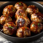 Low carb air fryer meatballs served on a plate with herbs
