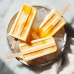 Mango Coconut Popsicles made with fresh fruit and coconut cream