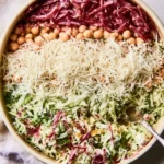 Plate of fresh Scala Chopped Salad with colorful vegetables and dressing